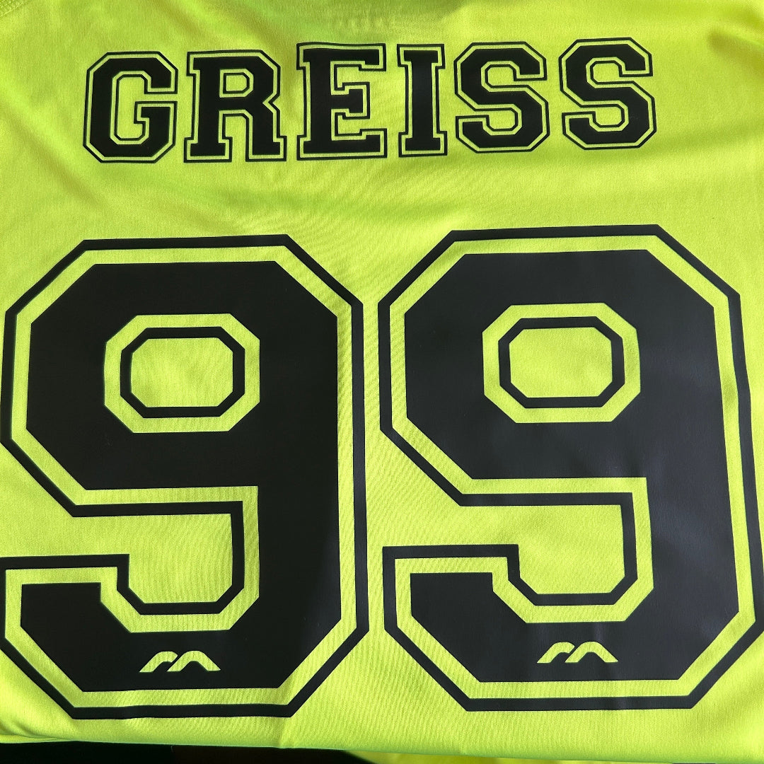 Yellow sports jersey with 'GREISS' and the number '99'