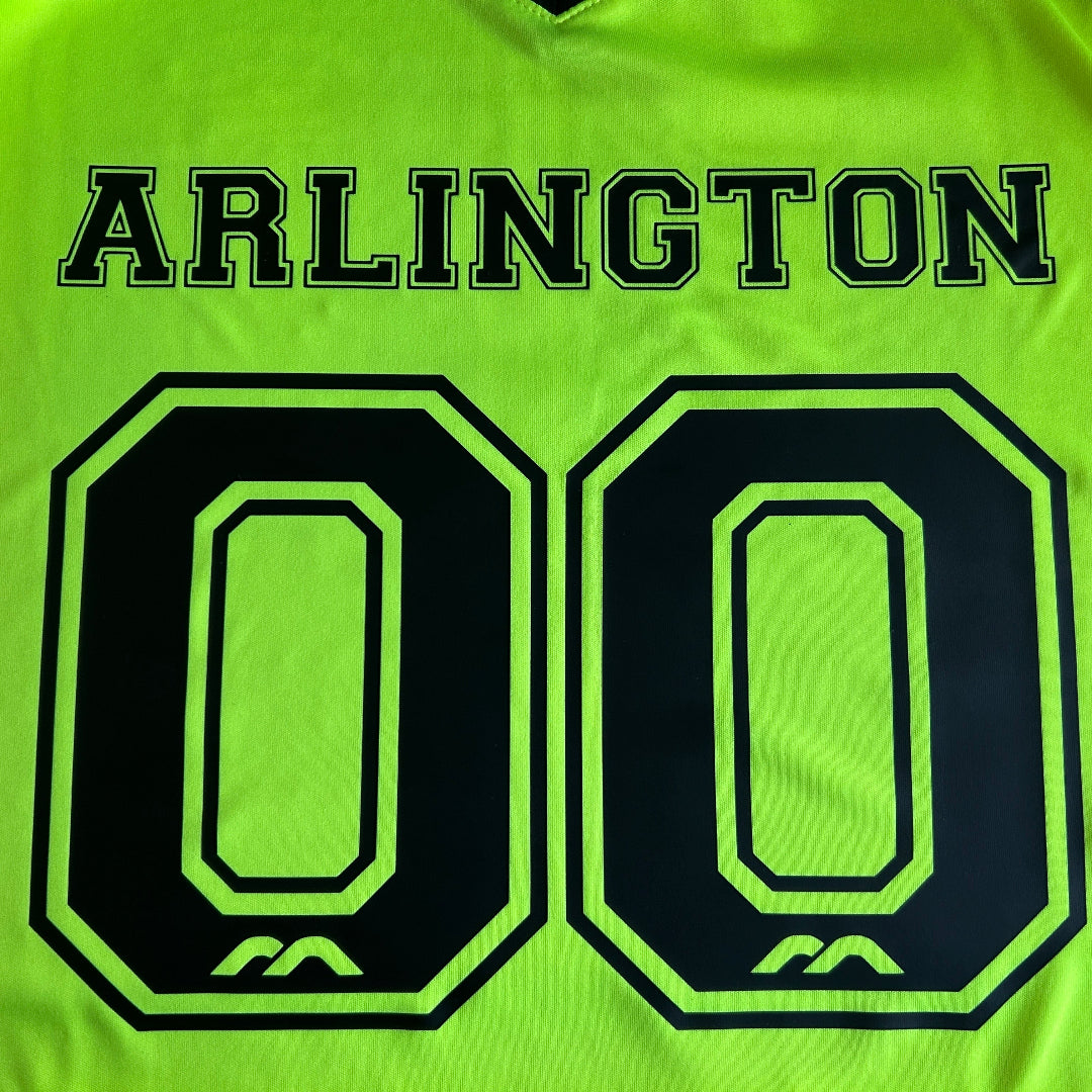 Green shirt with large black number '8' and 'ARLINGTON' text on a green background