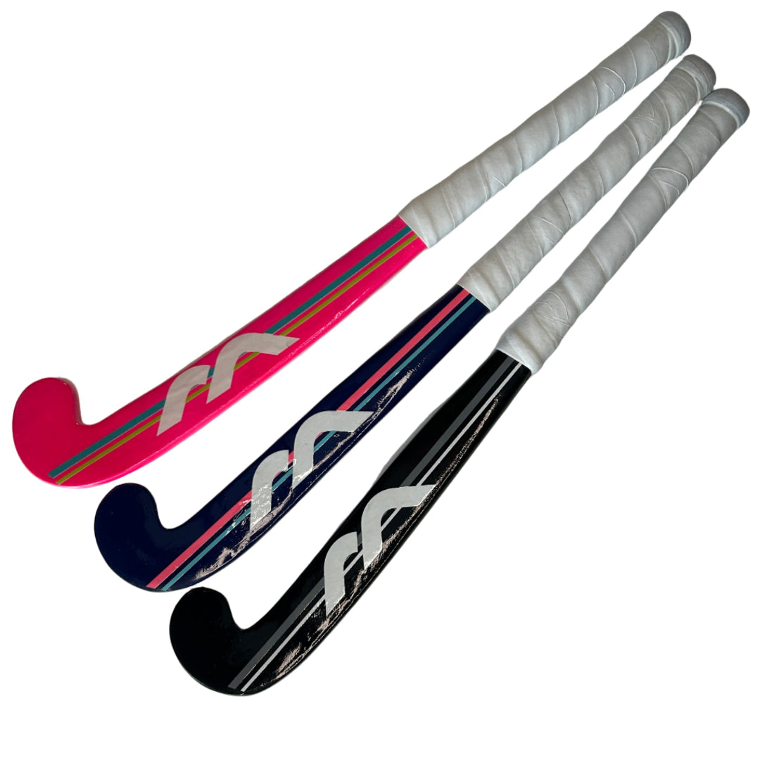 Three field hockey sticks of different colors on a white background