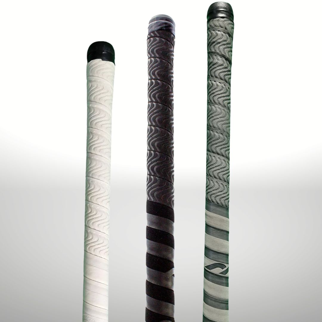 Three field hockey grips with different patterns on a grey background