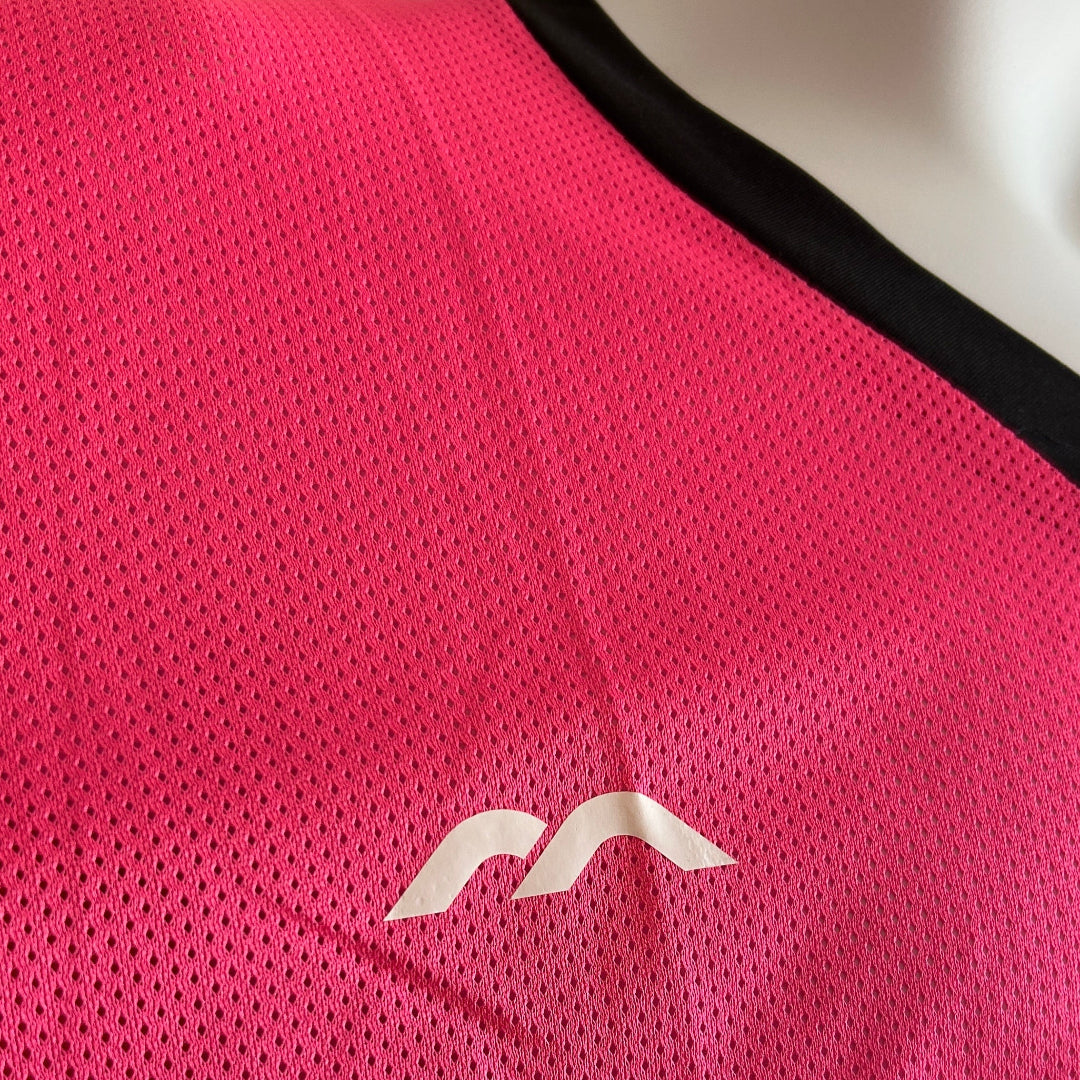 Pink athletic mesh GK jersey with a logo on a white background
