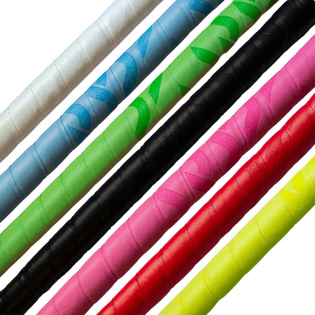 Colorful field hockey stick grips arranged in a row on a white background