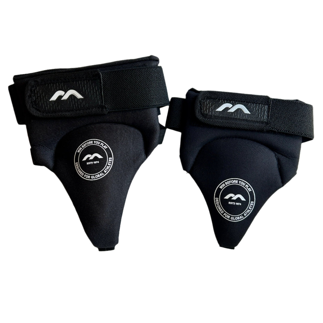 Pair of black pelvic protectors with branding on a white background